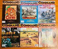 Photo showing six Command magazines laid out in two rows of three. Colorful front covers depict various battles and military themes including Cortes, Antietam, Napoleon's invasion of England, WWI 1914, War in Canada 1812, and a 'Like Lions They Fought' theme.