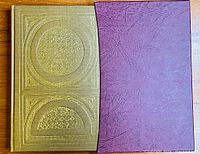 Gold embossed front cover and purple slipcase of The War in Granada book