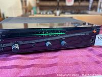 Front angled view showing volume and balance knobs, tuning meter and Harman Kardon logo with model number 230E.