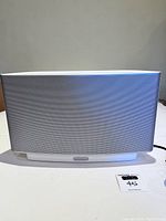 Front view of the white Sonos ZonePlayer S5 multi-room wireless speaker with metal grille.