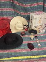 Wide shot showing the lot items arranged on fabric background