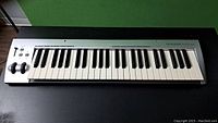 Front view of the M-Audio KeyStudio keyboard showing 49 keys and control wheels.