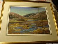Front view of framed pastel landscape painting