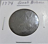 Reverse side of the 1774 Great Britain George III copper half penny coin showing Britannia seated with shield and trident.