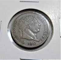 Close-up front side of 1817 coin showing King George III profile with surrounding inscription and date 1817.