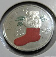 Front view of 2006 Canadian 25 cents coin with colored Christmas stocking and foliage in brilliant uncirculated condition