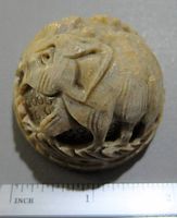 Top-down close-up of the hand carved stone elephant figurine showing detailed carving and size relative to ruler.