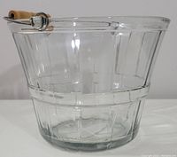 Front view showing full glass bucket with metal handle and wooden grip