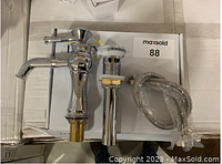 Photo of the chrome finished Zuzia faucet with included pop-up drain assembly and braided supply lines.