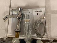 Complete faucet set including faucet, pop-up drain and braided water supply lines.