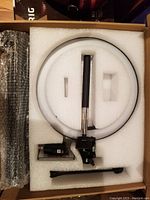 10 inch LED ring light in original foam packaging showing ring and accessories