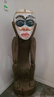 Front view of entire figurine showing full form and posture
