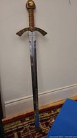 Full view of 38-inch sword showing straight double-edged blade, crossguard and pommel