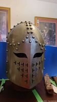 Front view showing eye slits and T-shaped ventilation cutouts