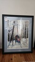 Full view of framed print showing snowy forest scene with two children at portal