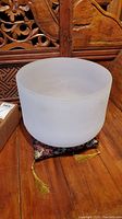 Front view of crystal bowl resting on cushion