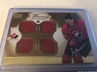 Front of hockey card showing Corey Perry image, Team Canada logo, and four red jersey patches.