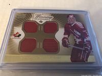 Front of the trading card showing Chris Pronger image and four red game-used jersey swatches arranged in a quad pattern.