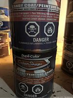 Photo showing front label on Dupli-Color candy coat spray paint can with danger warnings.