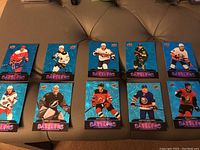 Ten Upper Deck Dazzlers hockey cards with blue holographic backgrounds showing NHL players in various team uniforms.