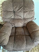 Front view of one brown Lay-Z-Boy power recliner showing cushioned armrests and backrest.