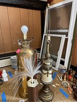 Photo of three lamps: brass fire extinguisher lamp, fibre-optic lamp, and vintage decorative lamp, showing arrangement and details