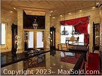 Photo of the interior of Azadi Jewellery store with ornate chandeliers, statues, and luxurious decor.