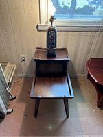 Full view of wooden end table with porcelain Asian inspired table lamp on top, showing size and overall appearance.