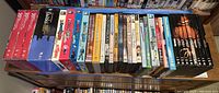 Photo showing a wide view of the DVD shelf including the Nightmare on Elm Street collection, Bewitched Complete Series, multiple In Living Color seasons, and other boxed DVD collections.