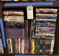 Photo showing DVDs including Rolling Stones, Motel Blue, Desperate Housewives, John Candy, Mysteries of the Bible Collection 7 volumes, and assorted other movie and TV DVDs