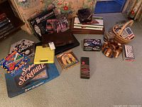 Full lot showing board games, card games, card shufflers, poker chips case, and wooden holders.