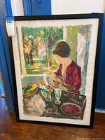 Full view of framed watercolor painting showing woman in red dress holding guitar with garden background.