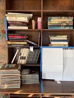 Bookshelves filled with assorted Time-Life books, hardbacks and other history books, some stacked and some shelved upright