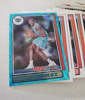 Close-up of Scottie Lewis NBA Hoops rookie card with blue holographic border.
