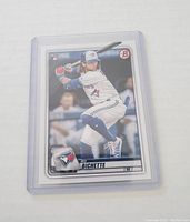 Front of 2019 Bowman Bo Bichette rookie card showing player in action batting pose.