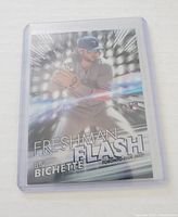 Front of Bo Bichette Freshman Flash Rookie Card in plastic sleeve, showing the player batting with silver and blue reflective design.