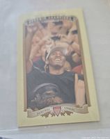 Front of Kawhi Leonard rookie basketball card showing player celebrating with fans, vintage style design with 'Basketball Forward' banner.