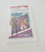 Front of the graded Kevin Durant card showing player images in Brooklyn Nets and Golden State Warriors jerseys, with P.A.A.S grading label Gem Mint 10