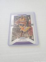 Front side photo of the Kobe Bryant basketball card showing him in a Lakers uniform with prism design