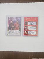 Front sides of two sports cards: Platinum Cuts featuring Messi and Ronaldo, Iconic Ink Triple Cuts featuring Pelé, Messi, and Ronaldo with their signatures.
