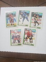 Front view of five O-Pee-Chee Super Rookie hockey cards featuring Sergei Fedorov, Mats Sundin, Jaromir Jagr, Mike Richter, and Ed Belfour.