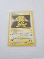 Front of Electabuzz Pokemon card showing character art, stats, and attack moves with yellow border.