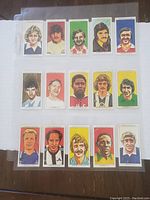 Front sides of 15 vintage soccer collectible cards featuring illustrated player portraits with colorful solid backgrounds.