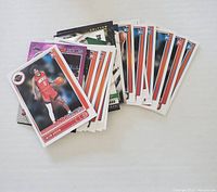 Top-down view of a stack of basketball rookie trading cards spread out, showing several cards with players and rookie labels.