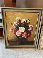 Full view of the chrysanthemum bouquet oil painting framed, showing flowers in a brown vase on a warm yellow background.