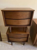 Stacked front view of both bedside tables showing identical styling and finish