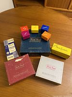 Overview showing game boxes and colorful category wedges on wooden table