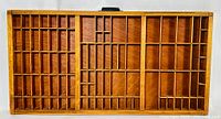 Top view showing multiple small compartments designed for letterpress type storage.