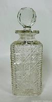 Full upright view of the Victorian hobnail cut crystal decanter with faceted ball stopper visible on top.