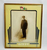 Front view of the framed WW1 RCNVR military photo showing the soldier in uniform and decorative mat with lettering and flag emblem.